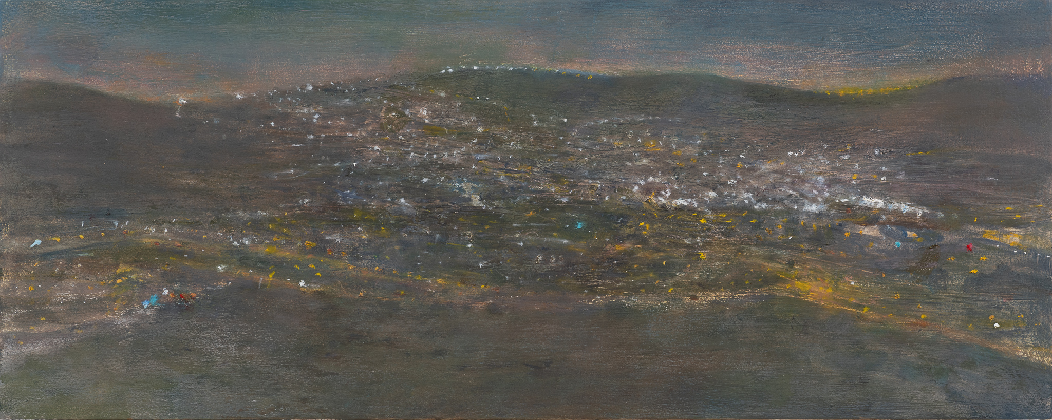 Evening view with sky of pink and dark blue, and mountains with purple blue and brown tones, dotted with sparkling touches of white and orange lights. 