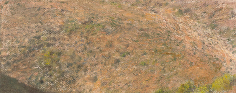 Rocky valley with a hint of two hillsides in the bottom corners.