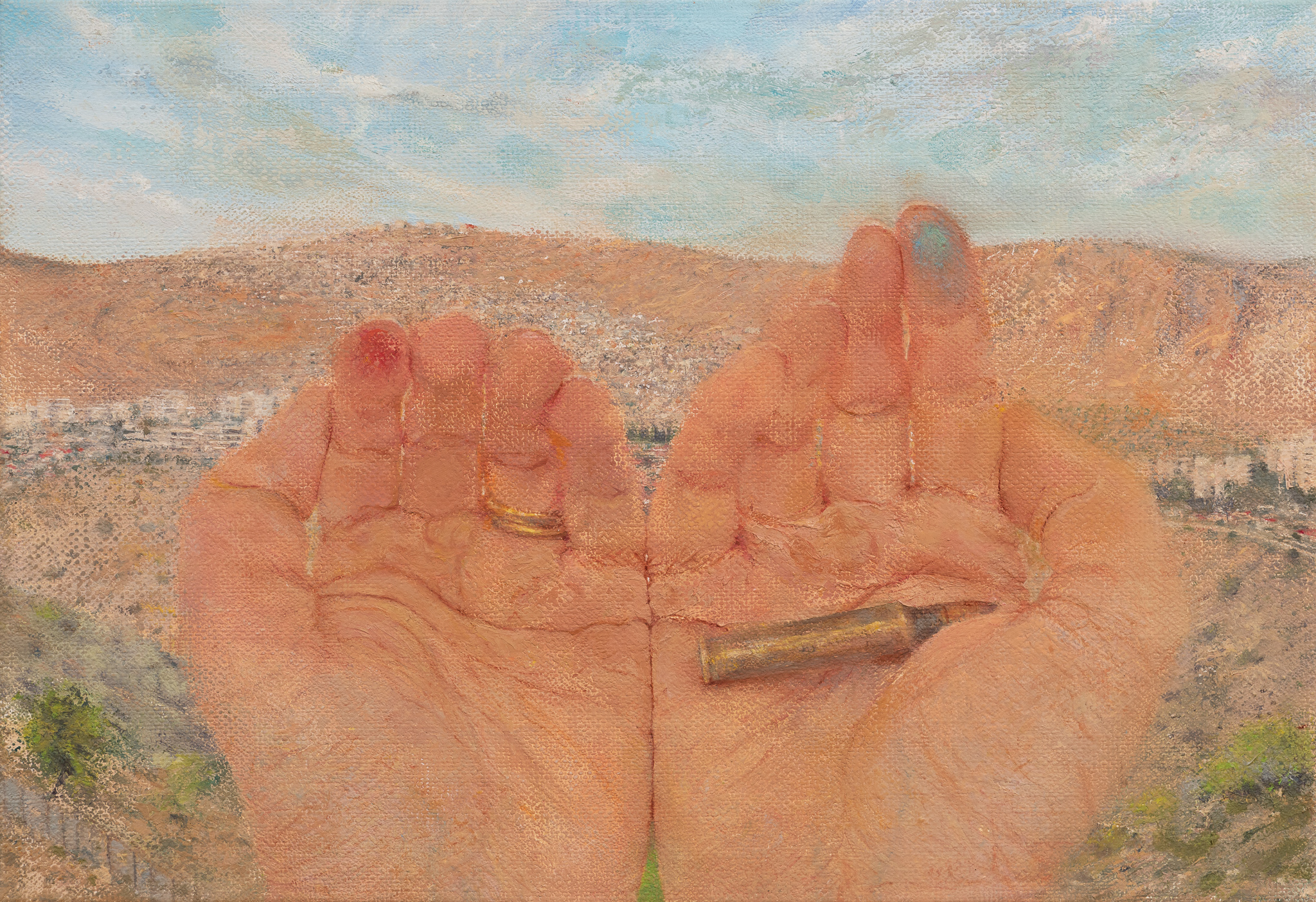 Two paint-stained hands facing the viewer, with landscape in the background. In the right hand lies a bullet.