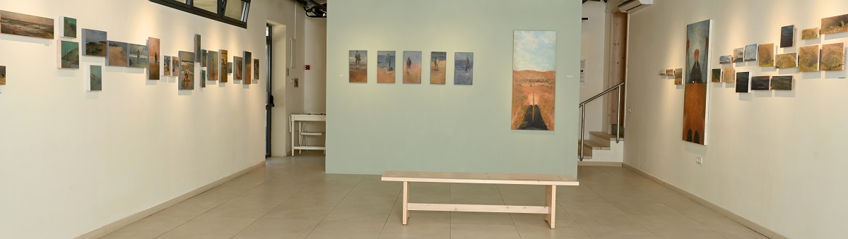 View of exhibition with many small paintings