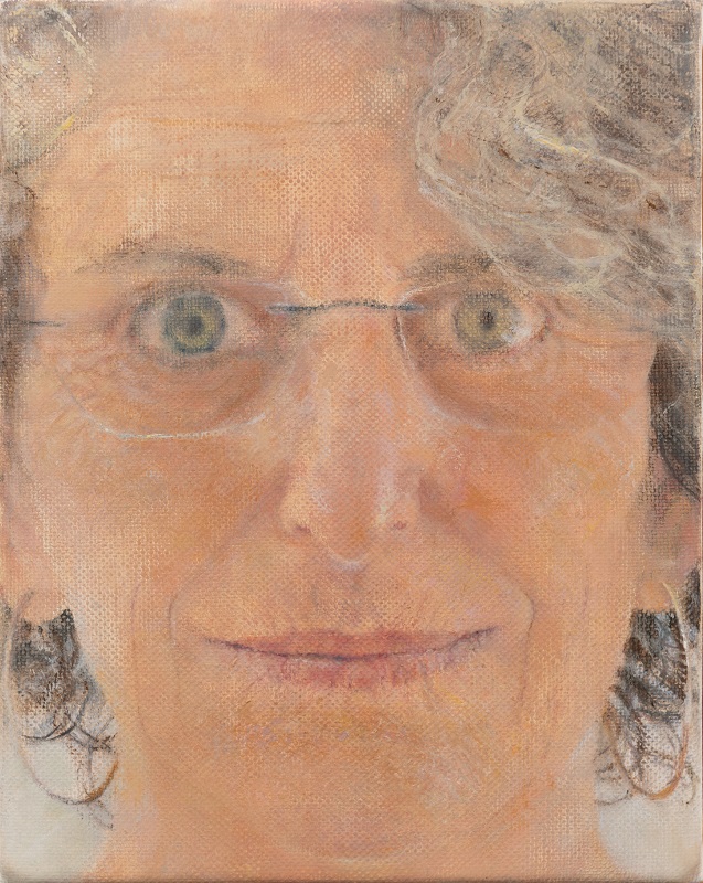 Close up of the artist's face, with a slight smile