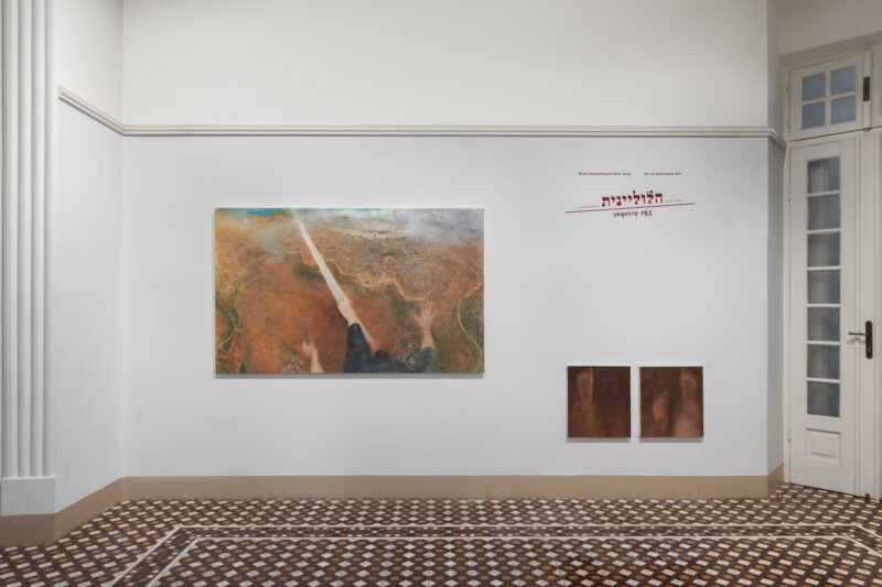 Gallery wall with large painting on left with image of figure on tightrope over the landscape, and two small paintings at right with feet walking