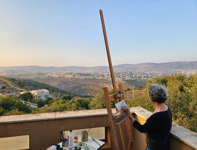 Ruth Kestenbaum Ben-Dov painting landscape from her studio balcony